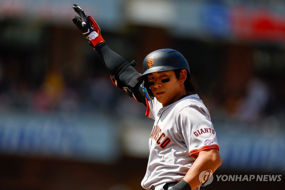 In this Getty Images photo, Lee Jung-hoo of the San Francisco Giants celebrates after hitting a single against the San Diego Padres for his first Major League Baseball hit during a regular-season game at Petco Park in San Diego on March 28, 2024. (Yonhap)