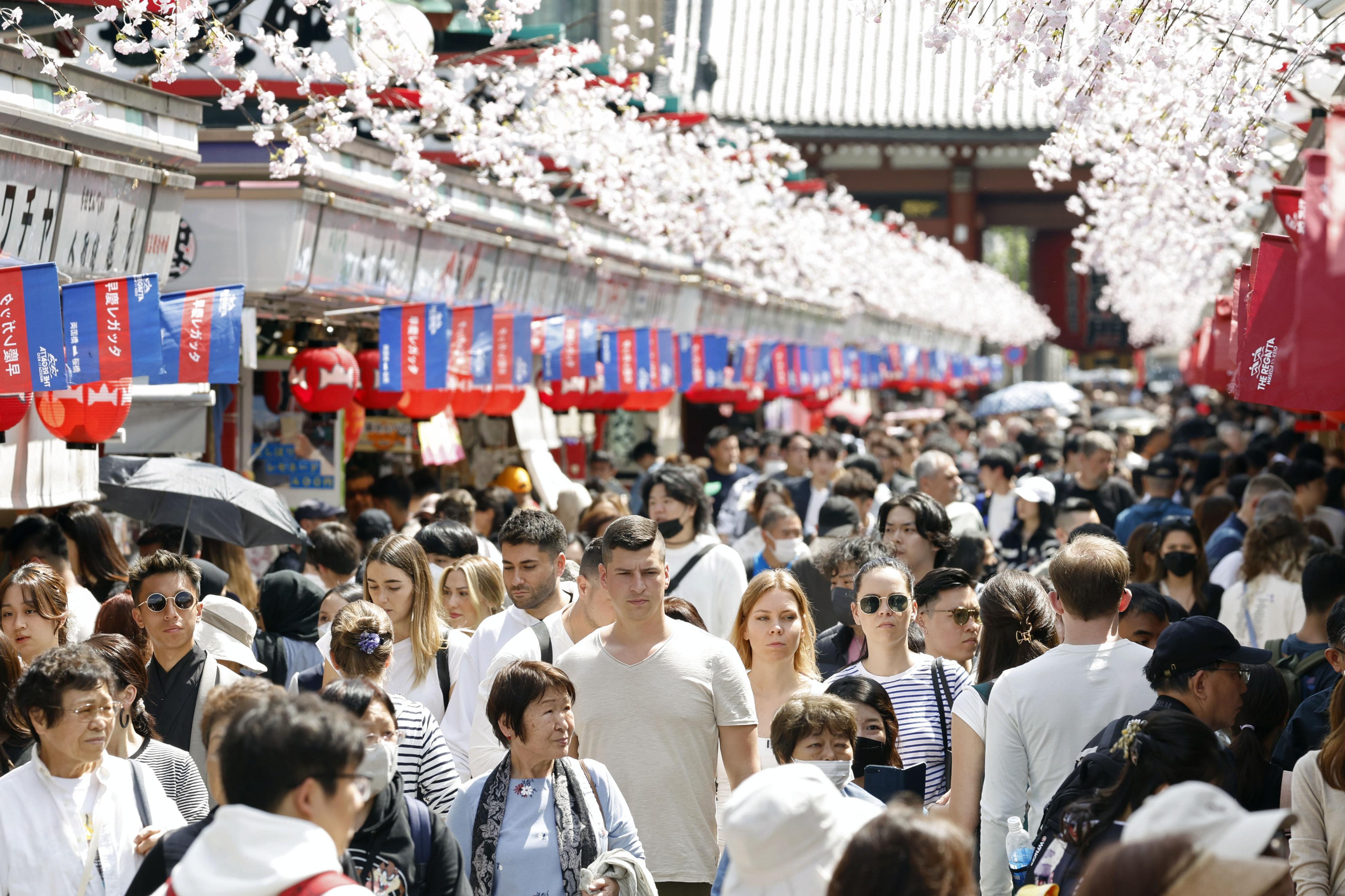The Nakamise shopping street in Tokyo's Asakusa area is crowded with visitors, including tourists from overseas, on April 17, 2024. (For editorial use only)(Kyodo)