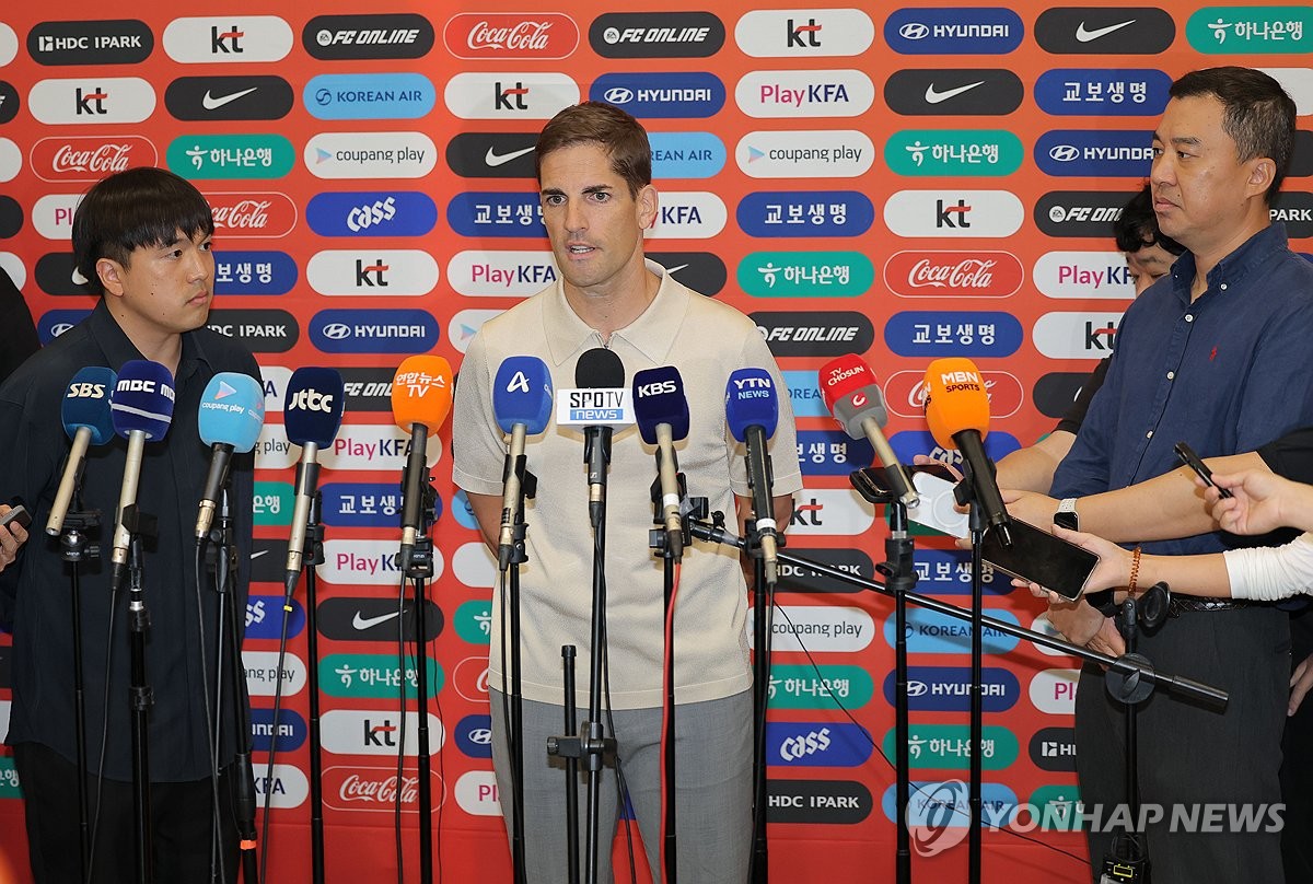 Robert Moreno, recently named interim head coach of the men's national football team, responds to questions from the press after arriving at Incheon International Airport, west of Seoul, on Sept. 13, 2026. (Yonhap) (END)