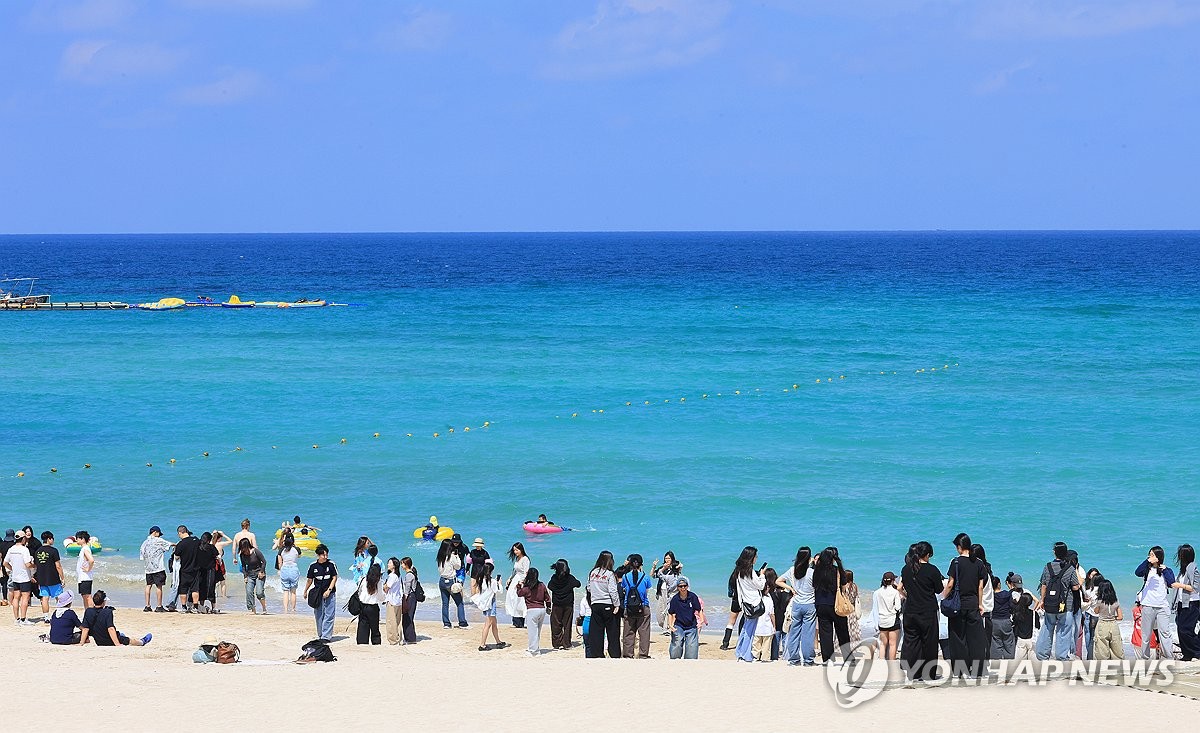 People visit Hamdeok Beach on the southern resort island of Jeju on Sept. 12, 2026, where a leisure festival is under way. (Yonhap) (END)