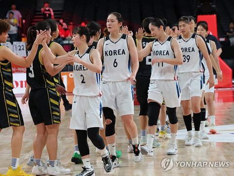 South Korean players celebrate after defeating Malaysia 106-40 in a women's basketball group-stage game at the Asian Games at Aichi International Arena in Nagoya, central Japan, on Sept. 18, 2026. (Yonhap) (END)