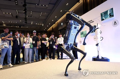 People look at a quadruped robot during the Samsung SDS Real Summit 2026 event at COEX in southern Seoul on Sept. 8, 2026. (Yonhap) (END)