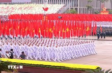 The formation featuring the Party flag and the National flag (Photo: VNA)