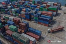 An aerial photo shows container trucks transporting cargo