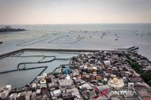 a fishing community protected by a sea wall in the Kampung Bahari Tambaklorok area, Tanjung Mas, Semarang, Central Java