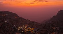 Sunset in Aseer: A Breathtaking Tableau of Clouds and Mountain Peaks