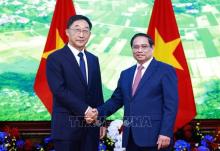 PM Pham Minh Chinh (right) welcomes Liu Ning, Secretary of the CPC Committee of China’s Guangxi Zhuang Autonomous Region, in Hanoi on August 28. (Photo: VNA)