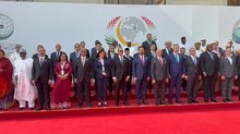 PM, Ali Al-Zaidi (center) stands among the participants in the 52nd Session of the OIC Council of Foreign Ministers in Baghdad