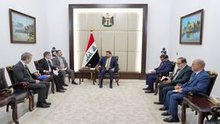 PM, Ali al-Zaidi (center), European Union Ambassador to Iraq Clemens Semtner (left) 