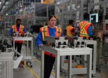 This undated file photo provided by LG Energy Solution Ltd. shows workers at NextStar Energy's battery plant in Ontario, Canada. (PHOTO NOT FOR SALE) (Yonhap)