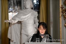 In this Reuters photo, Han Kang delivers her Nobel Prize lecture in literature on Dec. 7, 2024, at the Swedish Academy in Stockholm. (PHOTO NOT FOR SALE) (Yonhap)