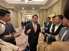 SK Group Chairman Chey Tae-won (C) speaks to reporters on the sidelines of the 2025 Trans-Pacific Dialogue hosted by the Chey Institute for Advanced Studies at a hotel in Washington on Feb. 21, 2025, in this pool photo. (PHOTO NOT FOR SALE) (Yonhap)
