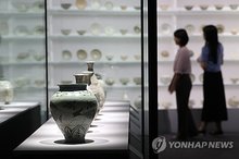 Visitors view Joseon-era ceramics on display during a special exhibition at the National Museum of Korea in Seoul on June 9, 2025. (Yonhap)