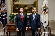 Foreign Minister Cho Hyun (R) and U.S. Secretary of State Marco Rubio pose for a photo during their talks in Washington, D.C., on Aug. 22, 2025, in this file photo provided by the foreign ministry. (PHOTO NOT FOR SALE) (Yonhap)