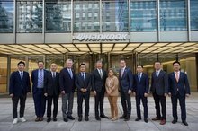 Gov. Bill Lee of the U.S. state of Tennessee (C) and Lee Soo-il (5th L), vice president of Hankook & Company, along with key officials, pose for a photo at the business group's headquarters in Seongnam, south of Seoul, on Oct. 24, 2025, in this photo provided by Hankook & Company Co. (PHOTO NOT FOR SALE) (Yonhap)