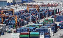 Containers are stacked at a port in Pyeongtaek, south of Seoul, in this file photo from May 8, 2026. (Yonhap)