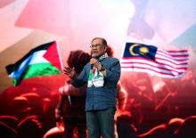 Prime Minister Anwar Ibrahim delivering a speech at the peak event of the 'Himpunan Pembebasan Palestin' at Axiata Arena on Sunday..