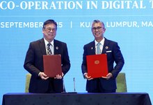Minister of Investment, Trade, and Industry, Tengku Zafrul Abdul Aziz and Hong Kong, China Secretary for Commerce and Economic Development, Algernon Yau, exchanging documents at the Signing Ceremony of the Memorandum Understanding Between the Government of Malaysia and the Government of the Hong Kong Special Administrative Region of People's Republic of China on Co-operation in Digital Trade in conjunction with the 57th AEM Meeting and Related Meetings