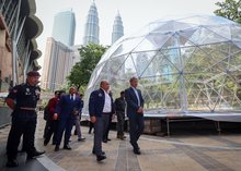 Malaysia's Foreign Minister Mohamad Hasan (right)