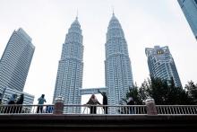 The Petronas Twin Towers are located in the heart of Kuala Lumpur