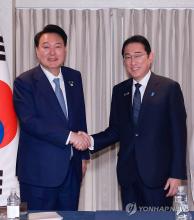 President Yoon Suk Yeol (L) and Japanese Prime Minister Fumio Kishida shake hands during their meeting in Washington, D.C., in this file photo taken July 10, 2024, on the sidelines of the North Atlantic Treaty Organization summit. (Yonhap)