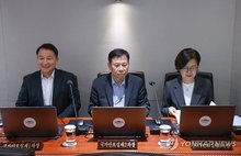 (From R to L) Oh Hyun-joo, the third deputy national security adviser; Im Woong-soon, the second deputy national security adviser; and Kim Hyun-jong, the first deputy national security adviser, attend a Cabinet meeting held at the presidential office on July 15, 2025. (Yonhap)