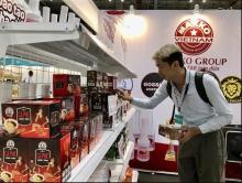 A consumer visit a booth at the Vietnam International Cafe' Show 2024. (Photo: VNA)