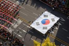 Members of the military march with a South Korean national flag during a military parade to mark the 76th anniversary of the armed forces day in Seoul, South Korea, October 1, 2024. REUTERS/Kim Soo-hyeon