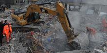  Three more people have been rescued from the debris of a six-storey building