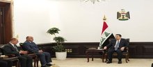 PM, Mohammed Shia al-Sudani (right), elected head of the Iraqi Journalists Syndicate Khalid Jassim (left), First Deputy Prime Minister Muayyad al-Lami
