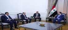 Prime Minister, Mohammed Shia al-Sudani (right), representatives of the American energy company HKN (left)