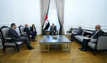PM, Mohammed Shia Al-Sudani (center), Deputy CEO of Shell Energy Company, Peter Costello ( left)