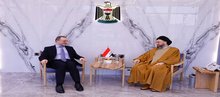Head of the National Wisdom Movement, Ammar al-Hakim, (right), the Russian Ambassador to Baghdad, Elbrus Kutrashev (left) 