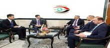 The head of the Integrity commission, Mohammed Ali Al-Lami (right), the Chinese ambassador, Cui Wei (left) 