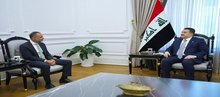 PM, Mohammed Shia Al-Sudani (right), the British Ambassador to Iraq, Irfan Siddiq (left)
