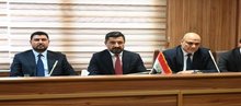 Minister of Justice Khaled Shawani (center) 