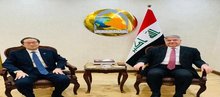 Deputy FM for Political Planning Affairs, Hisham Al-Alawi (right), S. Korean Ambassador to Baghdad, Lee Joon-il (left)