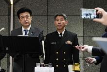 Defense Minister Minoru Kihara (L) holds a press conference at the ministry in Tokyo on April 22, 2024, as Maritime Self-Defense Force Chief of Staff Adm. Ryo Sakai looks on. (Kyodo) 