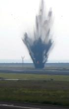 Fixed-point camera footage captures an explosion that occurred on the taxiway at Miyazaki Airport in southwestern Japan on Oct. 2, 2024. (Photo courtesy of the Civil Aviation College)(Kyodo)