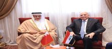FM Fuad Hussein (right), Bahraini FM, Abdullatif Al-Zayani (left)