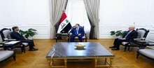 PM, Mohammed Shia Al-Sudani (center), the Special Representative of the United Nations Secretary-General for Iraq, Mohammed Al-Hassan (left)