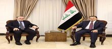 Iraqi National Security Advisor Qasim al-Araji (right), the Russian Ambassador to Baghdad, Elbrus Kutrashev (left)