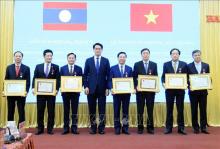 At a ceremony presenting Laos' friendship orders to Nam Dinh leaders of different periods, which is held in Nam Dinh province on March 18. (Photo: VNA)