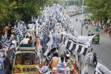 Thousands Sit-in On NATO Supply Route In NW Pakistan  