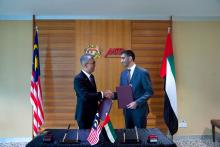 Malaysia's Investment, Trade and Industry Minister Tengku Zafrul Abdul Aziz (left) and UAE Minister of State for Foreign Trade Dr Thani bin Ahmad Al Zeyoudi.