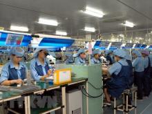 Workers at an electronic spare part manufacturing plant in Vietnam (Illustrative image. Source: VNA)
