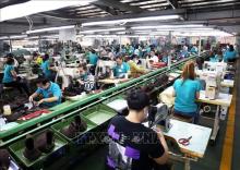 Vietnam's growth is underpinned by diverse sectors, from high-tech manufacturing to natural resources, and bolstered by significant trade relationships, especially with the US and China. (Illustrative photo - Source: VNA)