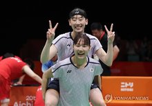 Baek Hana (front) and Lee So-hee of South Korea celebrate after winning gold in the women's doubles badminton event at the Aichi-Nagoya Asian Games at Ichinomiya City Municipal Gymnasium in Ichinomiya, Japan, on Sept. 29, 2026. (Yonhap)