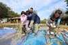 Children experience rice harvesting