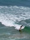 A surfer rides waves off a beach in the town of Yangyang, Gangwon Province, northeastern South Korea, on Aug. 4, 2026. (Yonhap) (END)